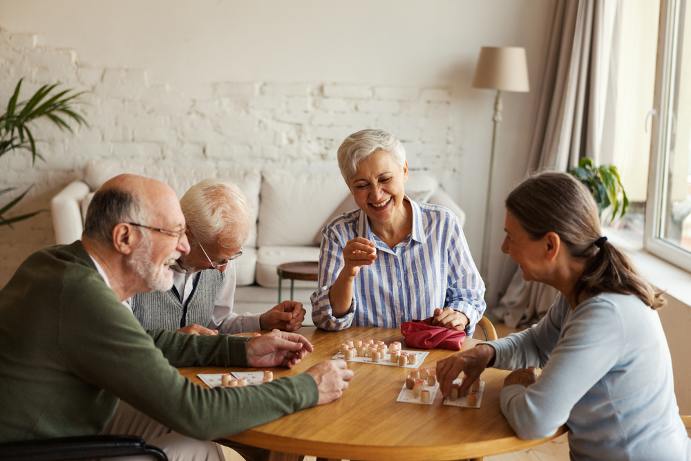 Group of four senior friends plying bingo