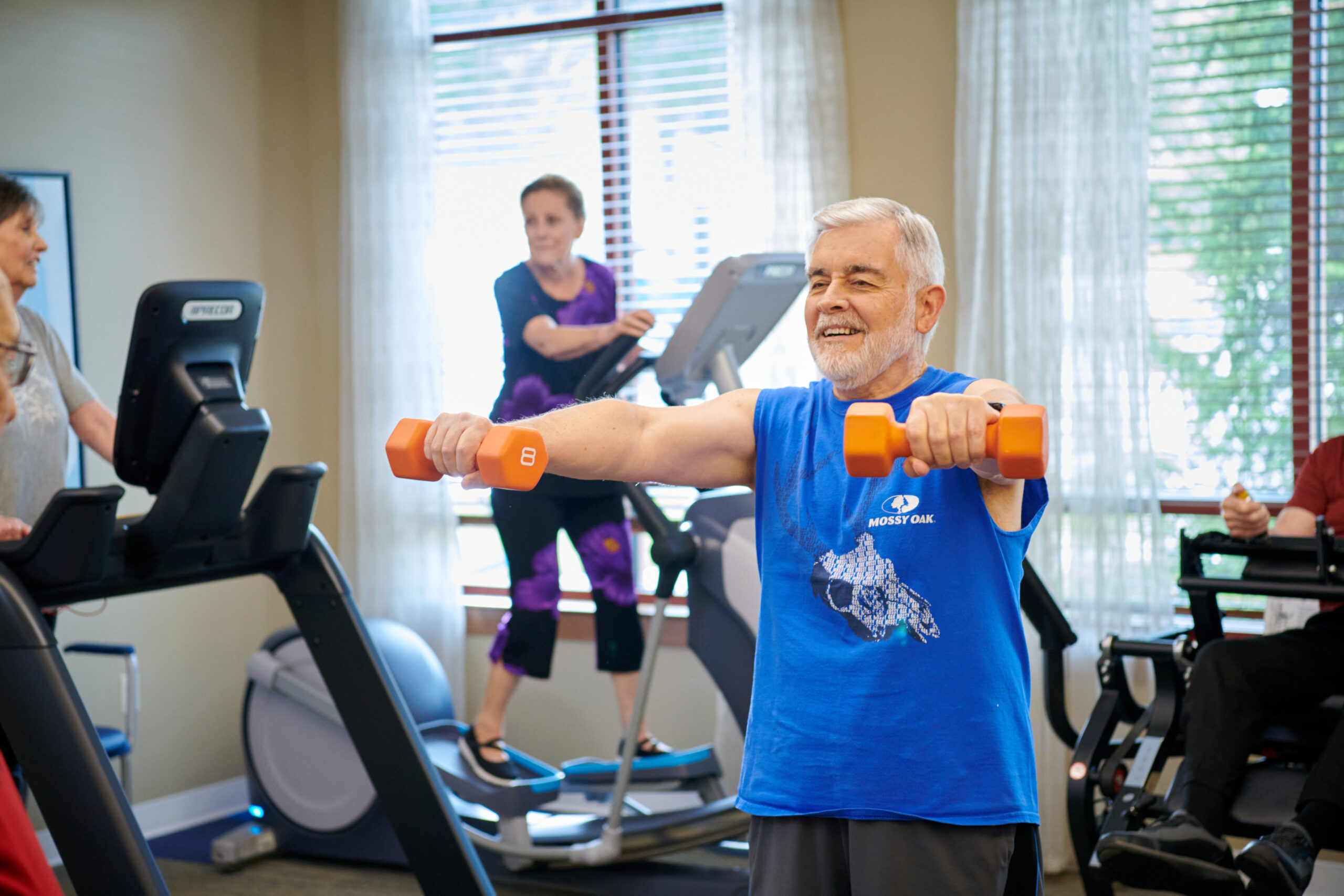 Seniors working out in John Knox Village's fitness center