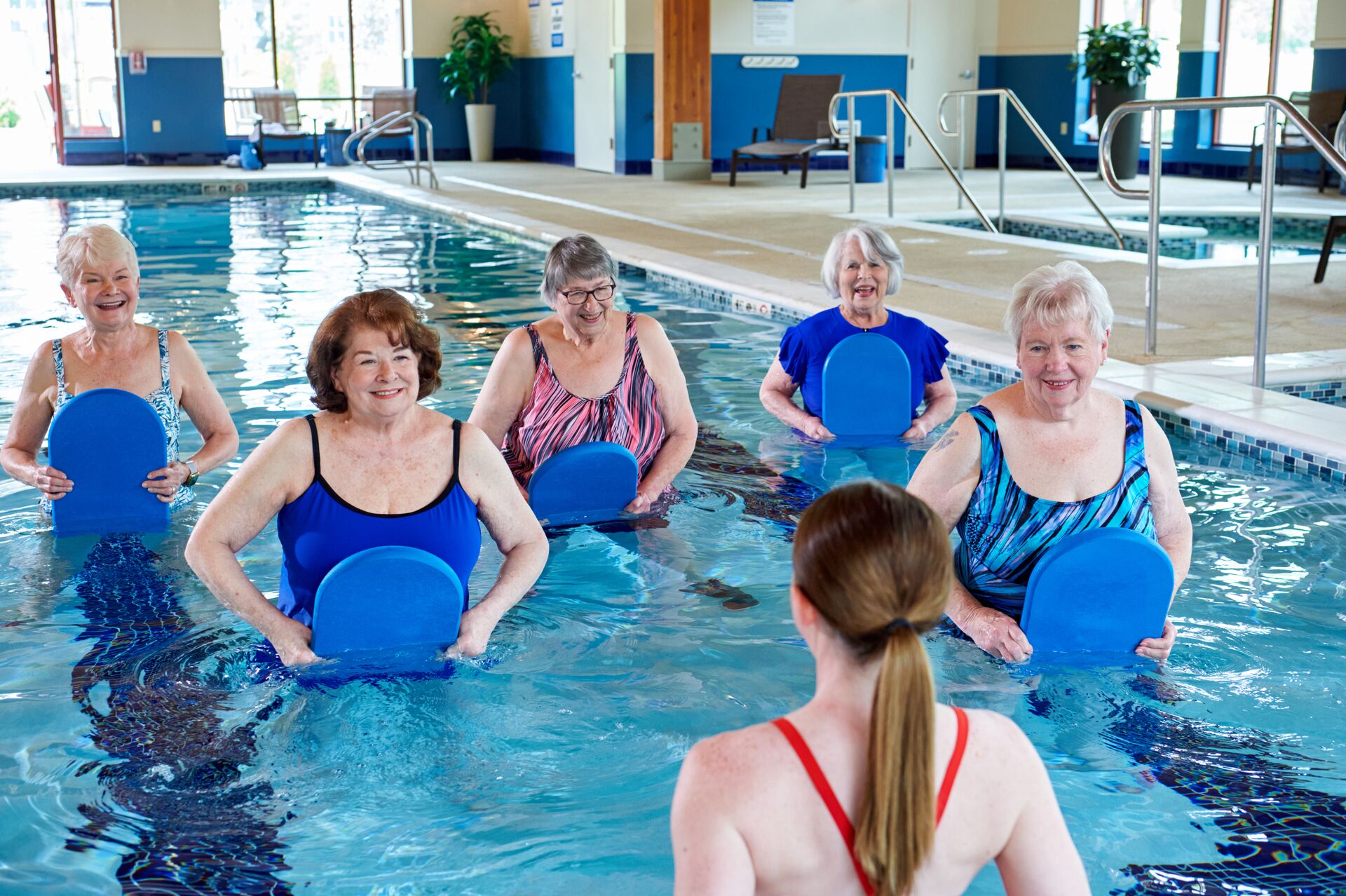 group of senior women taking a water exercise class