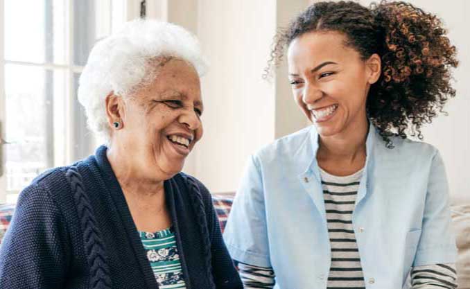 A woman visits her elderly mother