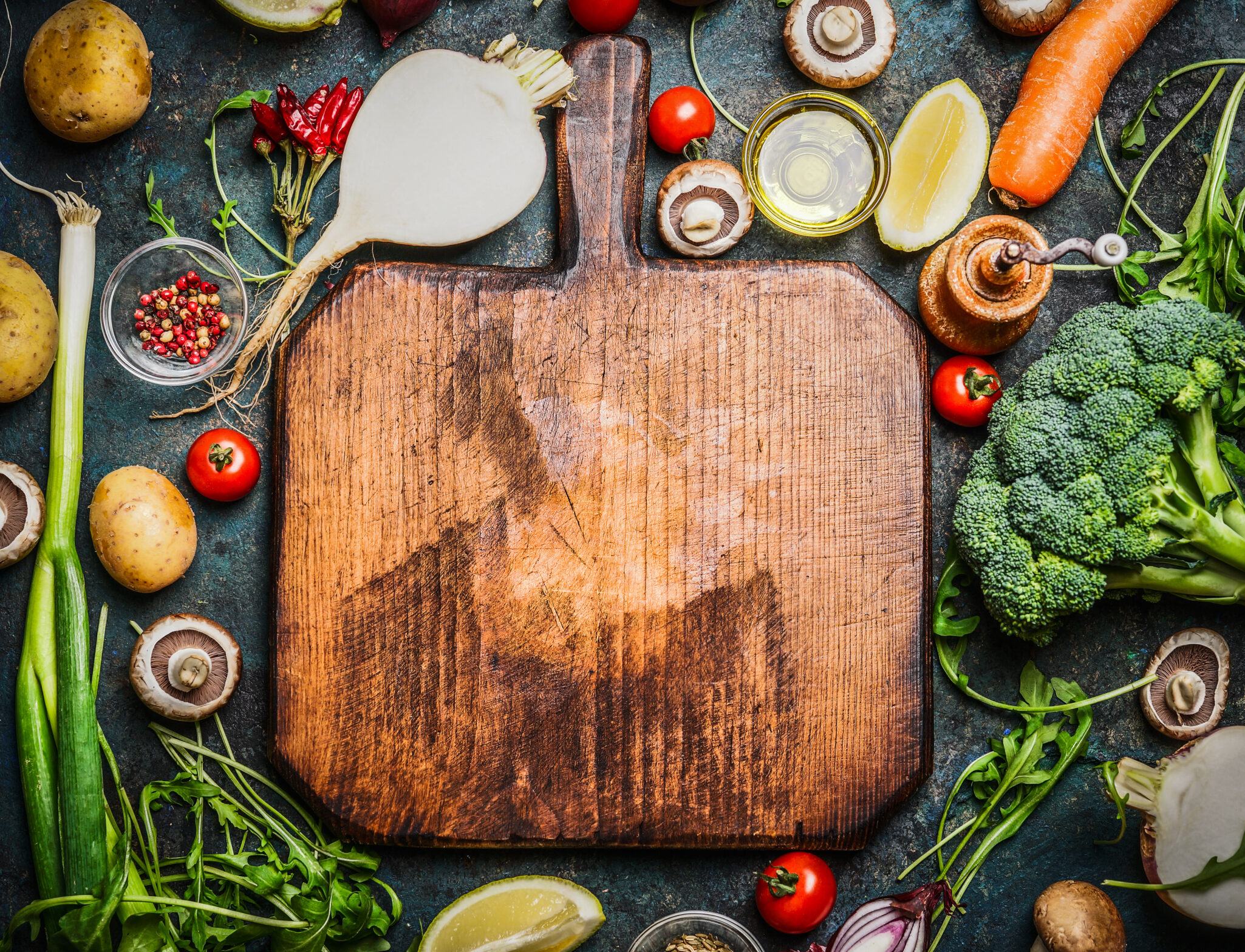 Fresh,Vegetables,And,Ingredients,For,Cooking,Around,Vintage,Cutting,Board cutting board with vegetables and ingredients for cooking