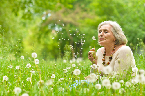 Senior,Woman,In,Green,Park Senior woman in spring garden